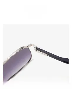 Detail view of retro silver metal sunglasses with purple gradient lenses and hinges