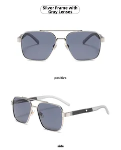 Close-up of silver metal pilot sunglasses with gray lenses and textured frame details