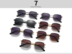 Collection of vintage round metal sunglasses in seven assorted colors on white background