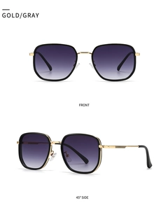 Detail view of round sunglasses with gold metal frame and purple gradient lenses