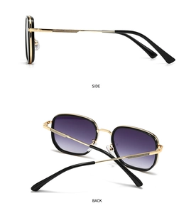 Detail view of round metal sunglasses with black gold frames and purple gradient lenses