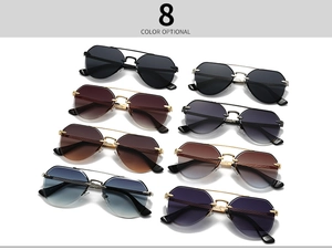 Detail view of eight multi-colored rimless aviator sunglasses with metal double bridges
