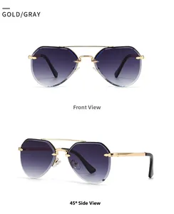 Close-up of gold pilot sunglasses with rimless gradient lenses and faceted edges