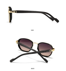 Detail view of vintage sunglasses featuring gradient lenses and wood grain texture temples