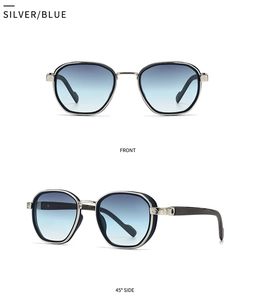 Close-up of silver metal sunglasses with blue gradient lenses and wood texture temples