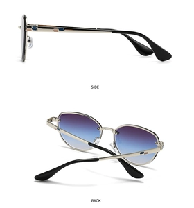 Detail view of silver metal hinges and blue-tinted gradient lenses on sunglasses