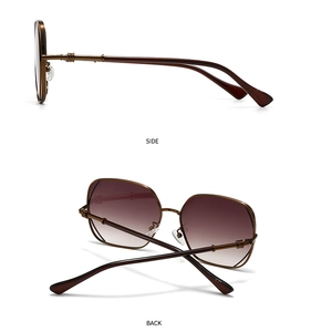 Detail view of bronze metal frame sunglasses with textured temples and gradient lenses