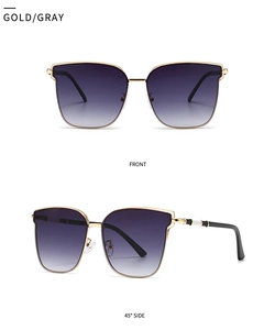 Detailed front and 45-degree side view of gold metal sunglasses with gray gradient lenses