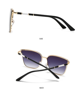 Detail view of gold metal sunglasses with purple gradient lenses and tricolor temple design