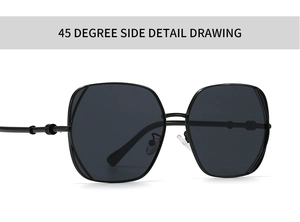 Detail shot of black sunglasses with metal frames and golden spherical hinge decoration