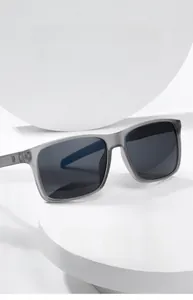 Detail of square oversized polarized sunglasses with translucent grey frames and UV protection