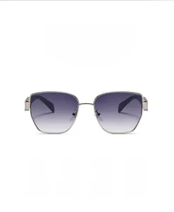 Detail of purple gradient lenses and thin gold metal frame of fashion sunglasses
