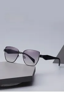 Detail shot of rectangular sunglasses with purple gradient lenses and geometric temples