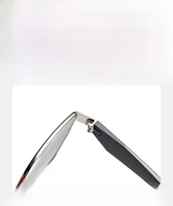 Detail of durable silver metal hinge connecting dark grey matte sunglasses temple and frame