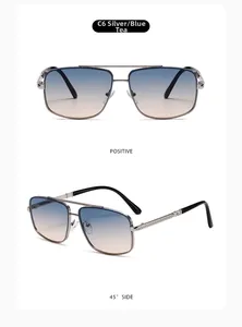 Detail view of silver metal sunglasses with blue-brown gradient lenses and engraved temples