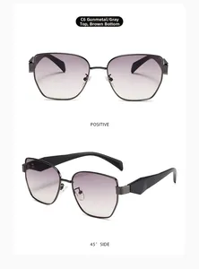 Detail of gunmetal frames with grey to tea gradient lenses and geometric temple tips