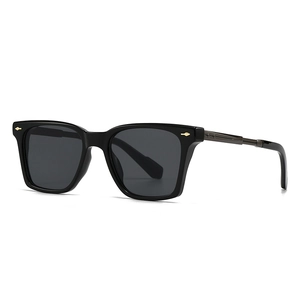 Classic aviator square sunglasses with black frame and gold metal rivets on pure background