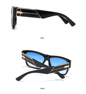 Detail view of black square sunglasses with gold metal temples and blue gradient lenses