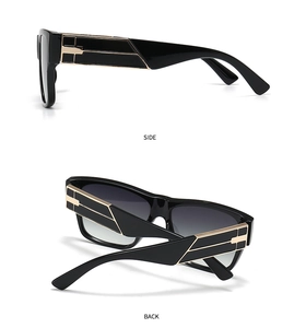 Detail view of black frame sunglasses showing gold geometric metal temple decoration