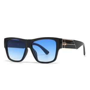 Modern oversized square sunglasses with black frame, blue gradient lenses and gold accents
