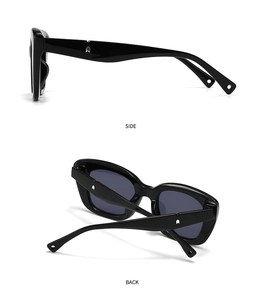 Detail view of black square sunglasses featuring silver arrow metal trim on the side temples