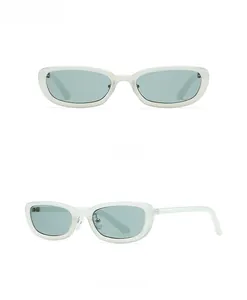 Detail view of retro green rectangle sunglasses with translucent frames and metal hinges
