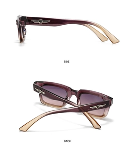 Detail of vintage square sunglasses with gradient lenses and silver wing temple accents
