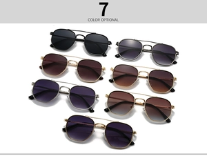 Flat lay of retro metal aviator sunglasses with double bridges in seven assorted colors