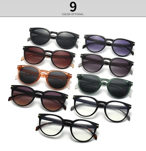 Flat lay of nine color options for classic round-frame glasses and sunglasses