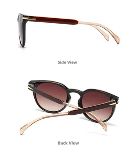 Detail view of round vintage sunglasses featuring gradient brown lenses and gold metal accents