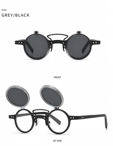 Detail of steampunk double layer flip-up sunglasses with black frames and gold rivets