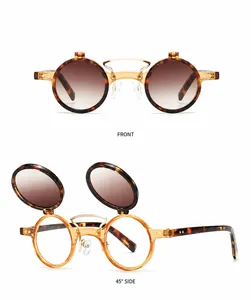 Detail view of retro steampunk double flip sunglasses with hawksbill frames and tea lenses