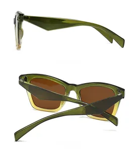 Detail view of olive green oversized metal sunglasses with wide geometric temples