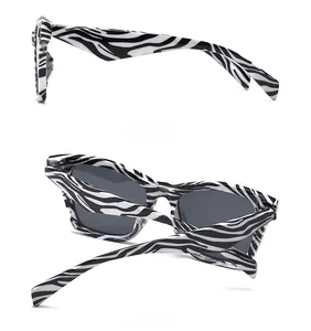 Detail view of zebra print sunglasses with thick temples from side and back angles