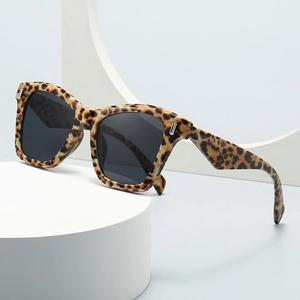 Oversized leopard print square sunglasses with dark grey lenses and metal accents