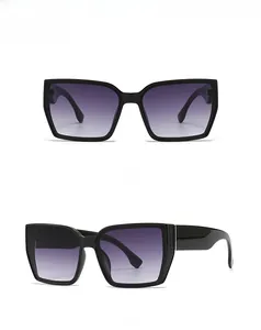 Front and side view of black oversized square sunglasses with gradient gray lenses
