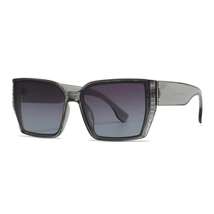 Fashionable oversized square sunglasses with gray transparent frame and silver cross detail