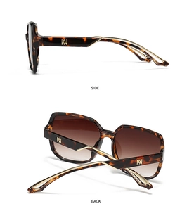 Detail view of square tortoiseshell sunglasses with gold metal temples and gradient lenses
