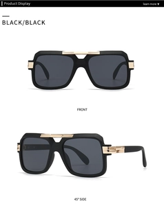 Detail of square pilot sunglasses with black frame and gold metal bridge accents