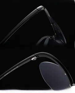 Dettaglio macro di occhiali da sole cat-eye con cerniere in metallo e lenti anti-UV