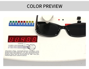 Detail view of butterfly frame sunglasses showing UV400 protection on testing device