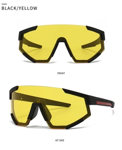 Detail of black sports sunglasses with yellow oversized lens and red temple stripe