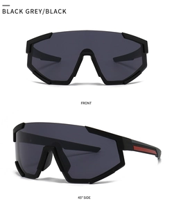Close-up of oversized shield sunglasses with black frames and red side stripe accents