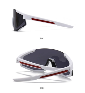 Detail of white oversized cycling sunglasses with red side stripes and smoke lenses