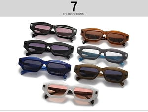 Collection of seven colorful rectangular geometric sunglasses displayed in a grid