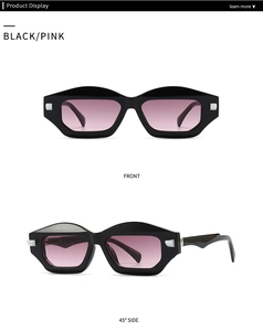 Close-up of geometric black sunglasses with pink gradient lenses and wavy temple detail