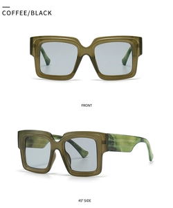 Close-up of trendy wide square blue light glasses with coffee black marble texture frame