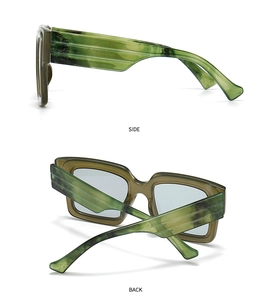 Detail view of rectangular sunglasses with green marble pattern frame and thick side temples