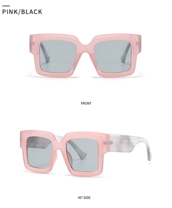 Detail view of pink transparent square glasses with white marble texture temples