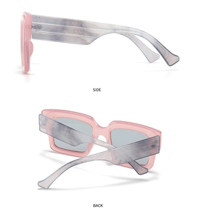 Detail view of pink square frames and grey marble temples on retro blue light glasses